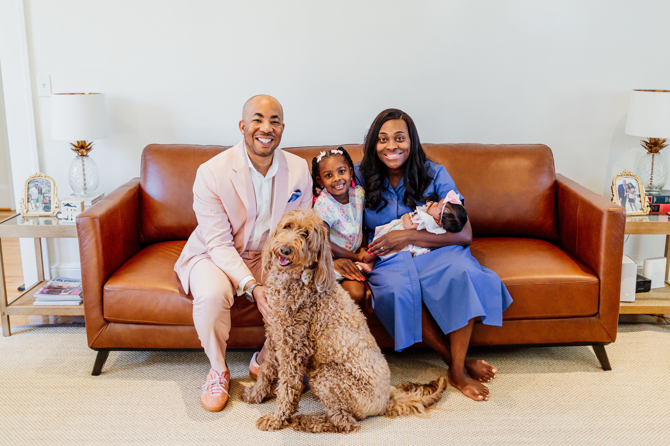 Sam Johnson, candidate for Columbia City Council At-large, poses with his family - wife Ashley Johnson, daughters Kennedy and Olivia, and Bates, their Golden Doodle